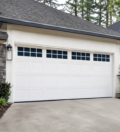 Garage door technician completing a detailed inspection